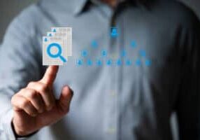 Business man work with laptop seek data to find a new job icon are floating on screen of tablet