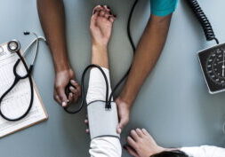 nurse-measuring-patient-blood-pressure-min